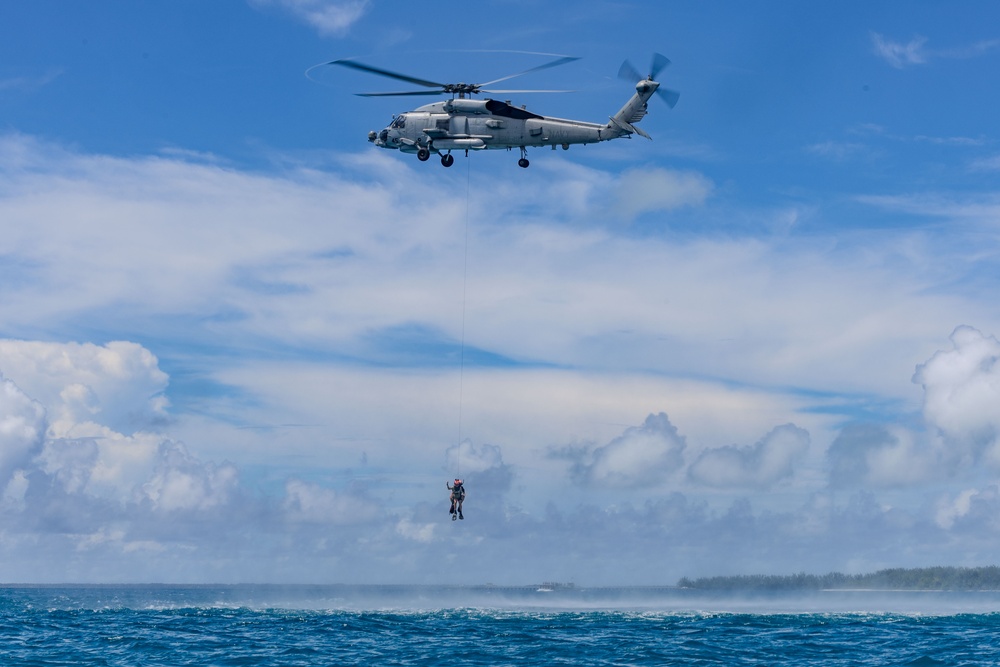 Search and Rescue Swimmers from HSM 49 det. 4 Practice Jumps off the Coast of Diego Garcia
