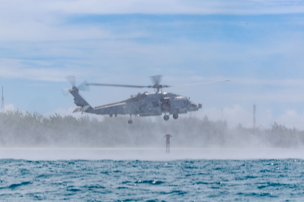 Search and Rescue Swimmers from HSM 49 det. 4 Practice Jumps off the Coast of Diego Garcia