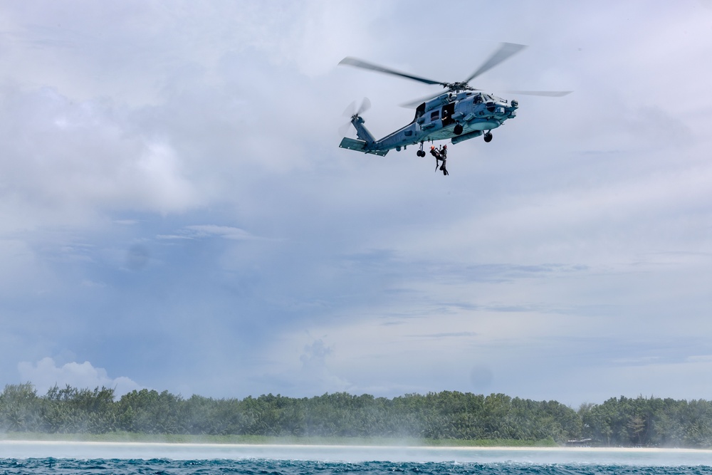 Search and Rescue Swimmers from HSM 49 det. 4 Practice Jumps off the Coast of Diego Garcia
