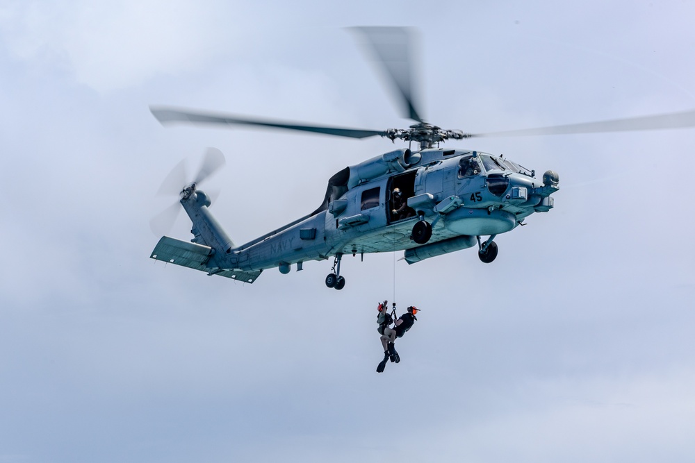 Search and Rescue Swimmers from HSM 49 det. 4 Practice Jumps off the Coast of Diego Garcia