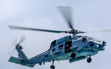 Search and Rescue Swimmers from HSM 49 det. 4 Practice Jumps off the Coast of Diego Garcia