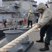 Seaman Niccole Bermundez heaves in a mooring line during a sea-and-anchor detail