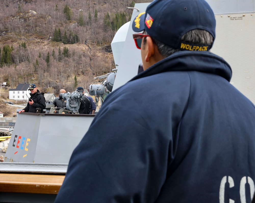 Commanding Officers confer nesting two ships abeam over radio