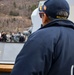 Commanding Officers confer nesting two ships abeam over radio