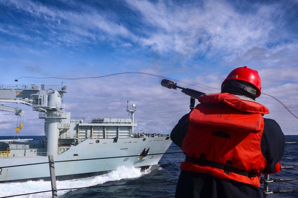 Gunner’s Mate 2nd Class Joshua Cvitic fires a shot line from the Bulkeley’s forecastle