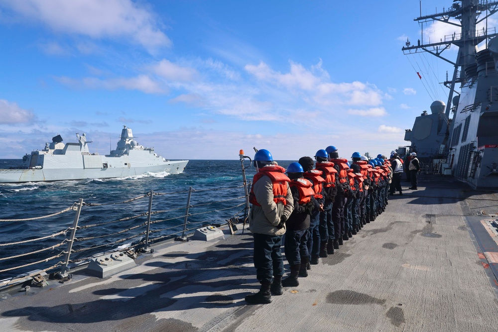 U.S. Navy Sailors observe HDMS Iver Huitfeldt (F361) a Royal Danish Navy Iver Huitfeldt-class frigate
