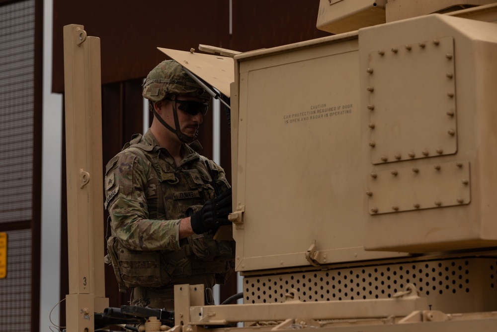 U.S. Soldiers operates detection system