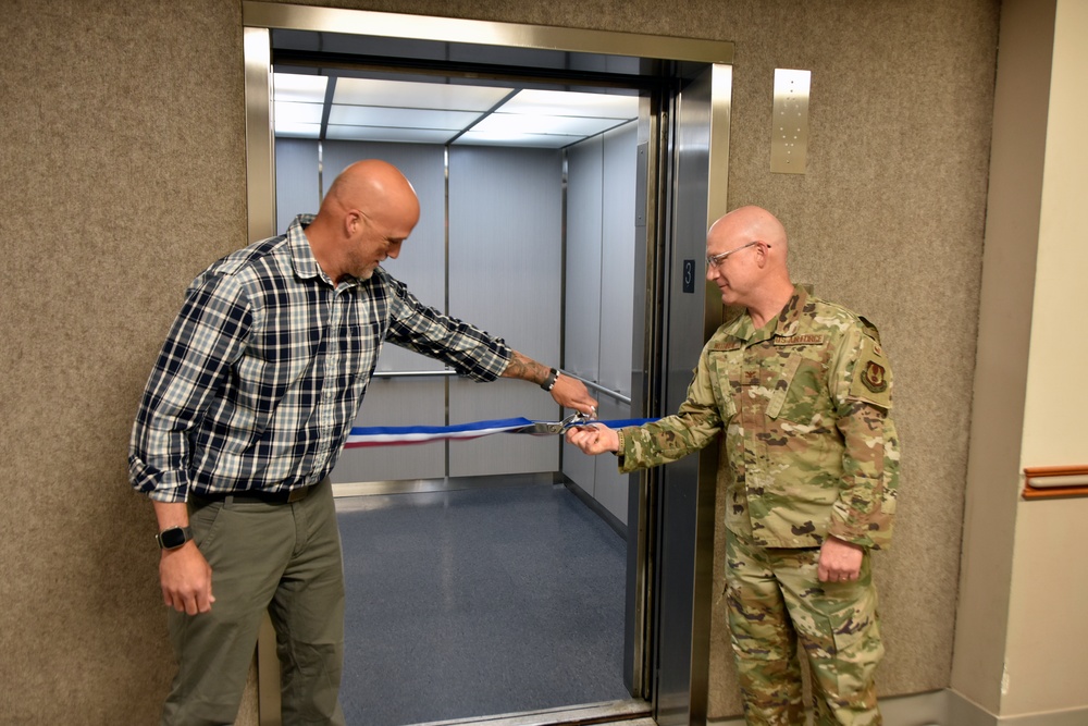 AEDC team members mark elevator replacement with ribbon cutting ceremony