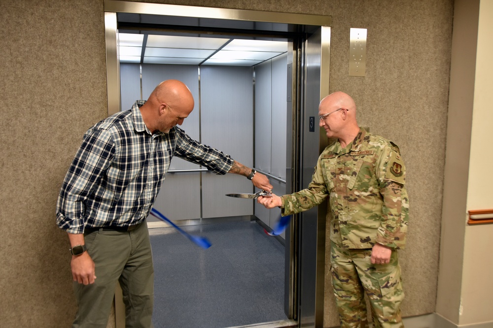 AEDC team members mark elevator replacement with ribbon cutting ceremony