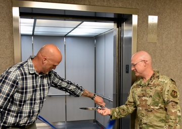 AEDC team members mark elevator replacement with ribbon cutting ceremony