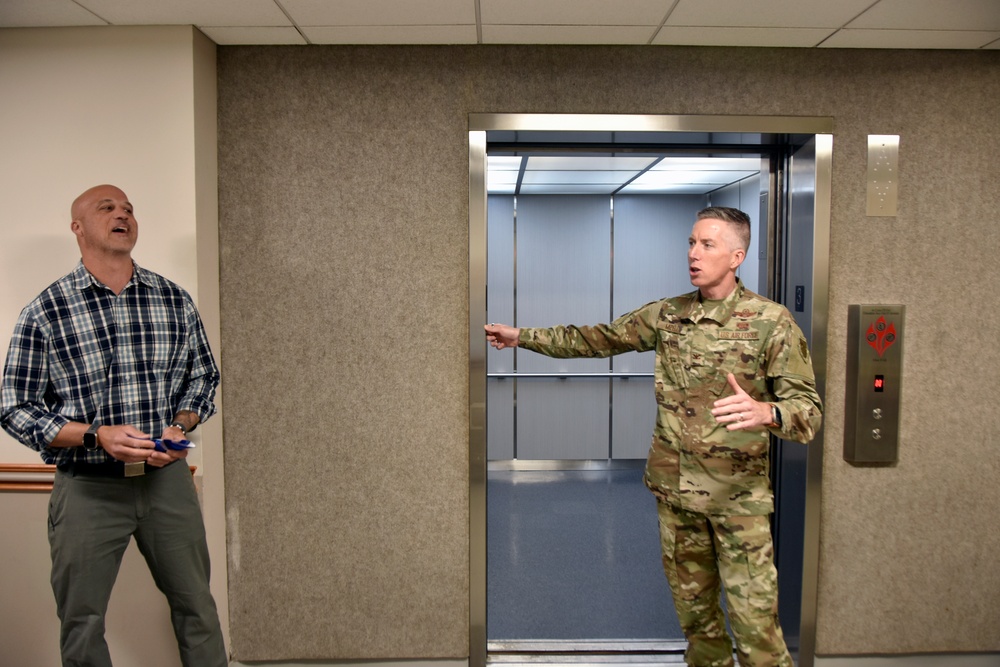 AEDC team members mark elevator replacement with ribbon cutting ceremony