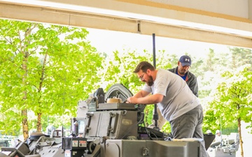 3rd Infantry Division Soldiers and Department of Defense civilian contractors install MILES gear on M2A4 Bradleys during Combined Resolve 25-02