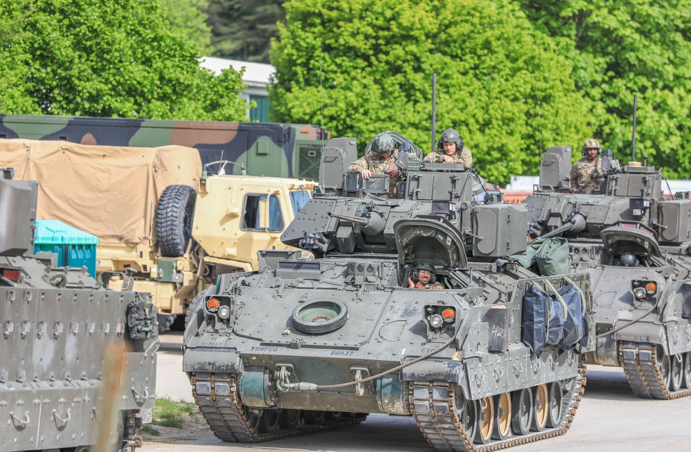 3rd Infantry Division Soldiers and Department of Defense civilian contractors install MILES gear on M2A4 Bradleys during Combined Resolve 25-02