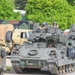3rd Infantry Division Soldiers and Department of Defense civilian contractors install MILES gear on M2A4 Bradleys during Combined Resolve 25-02
