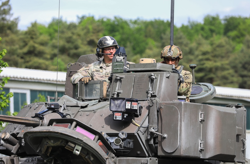 3rd Infantry Division Soldiers and Department of Defense civilian contractors install MILES gear on M2A4 Bradleys during Combined Resolve 25-02