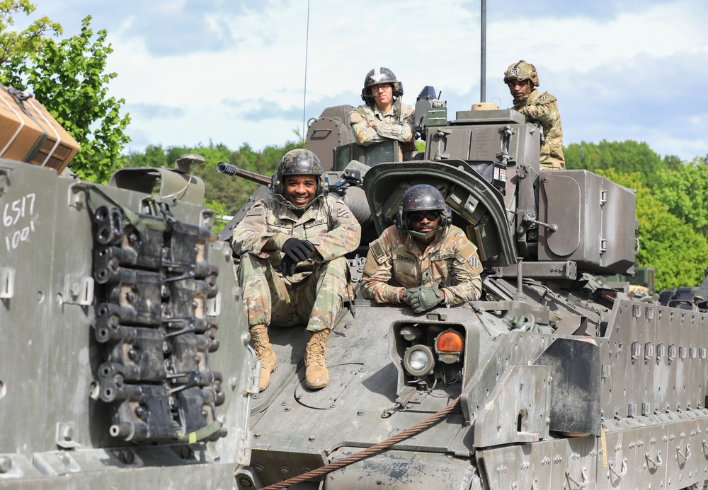 3rd Infantry Division Soldiers and Department of Defense civilian contractors install MILES gear on M2A4 Bradleys during Combined Resolve 25-02