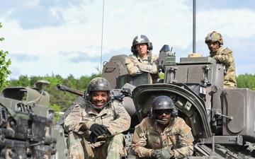 3rd Infantry Division Soldiers and Department of Defense civilian contractors install MILES gear on M2A4 Bradleys during Combined Resolve 25-02