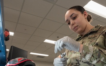 509th OSS AFE flight prepares life support equipment for pilots