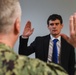 Rear Adm. James Waters, Commander, Navy Recruiting Command, left, conducts the Oath of Enlistment for future Sailor Edward Orcutt at Navy Talent Acquisition Group Ohio River Valley.