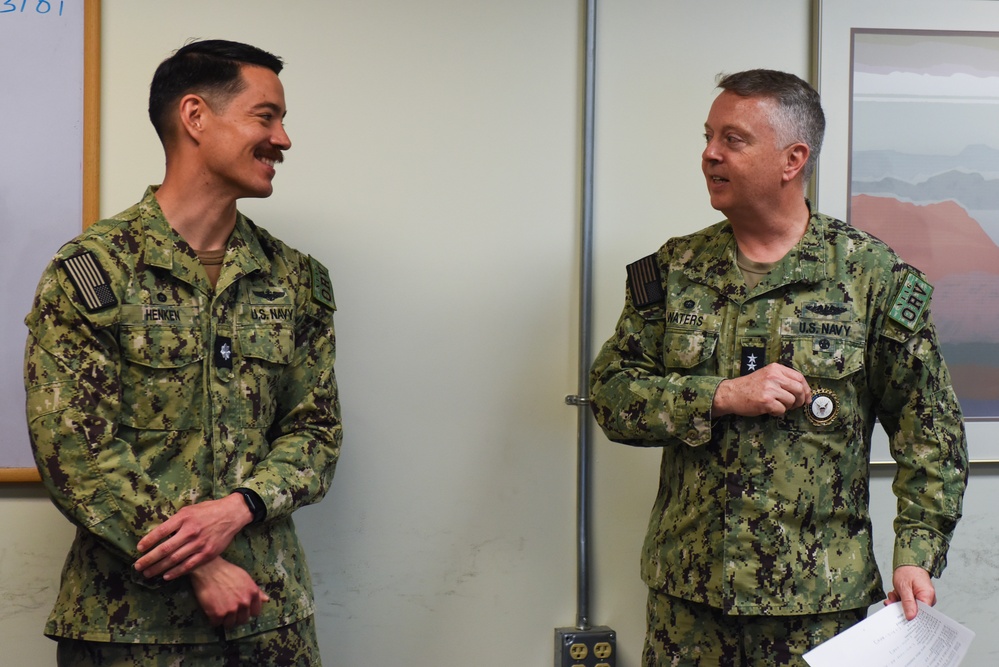 Rear Adm. James Waters, Commander, Navy Recruiting Command, right, speaks with Cmdr. Patrick Henken, commanding officer, Navy Talent Acquisition Group Ohio River Valley.