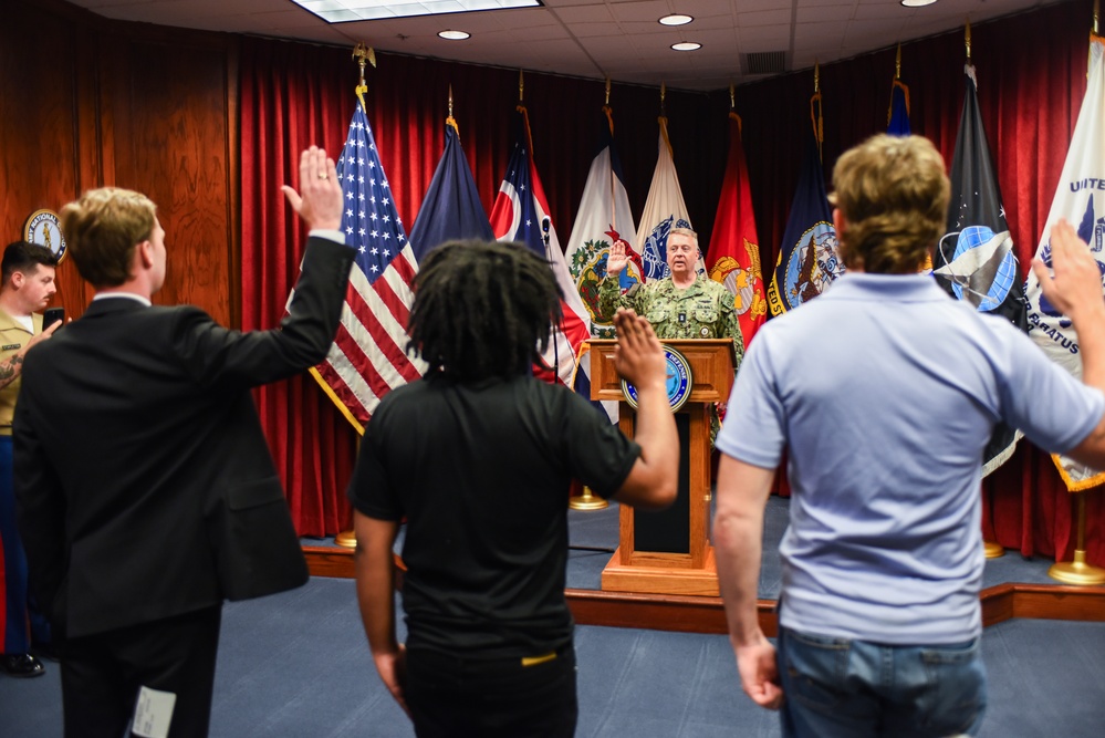 Rear Adm. James Waters, Commander, Navy Recruiting Command, administered the Oath of Enlistment to future Sailors and Marines at the Columbus Military Entrance Processing Station