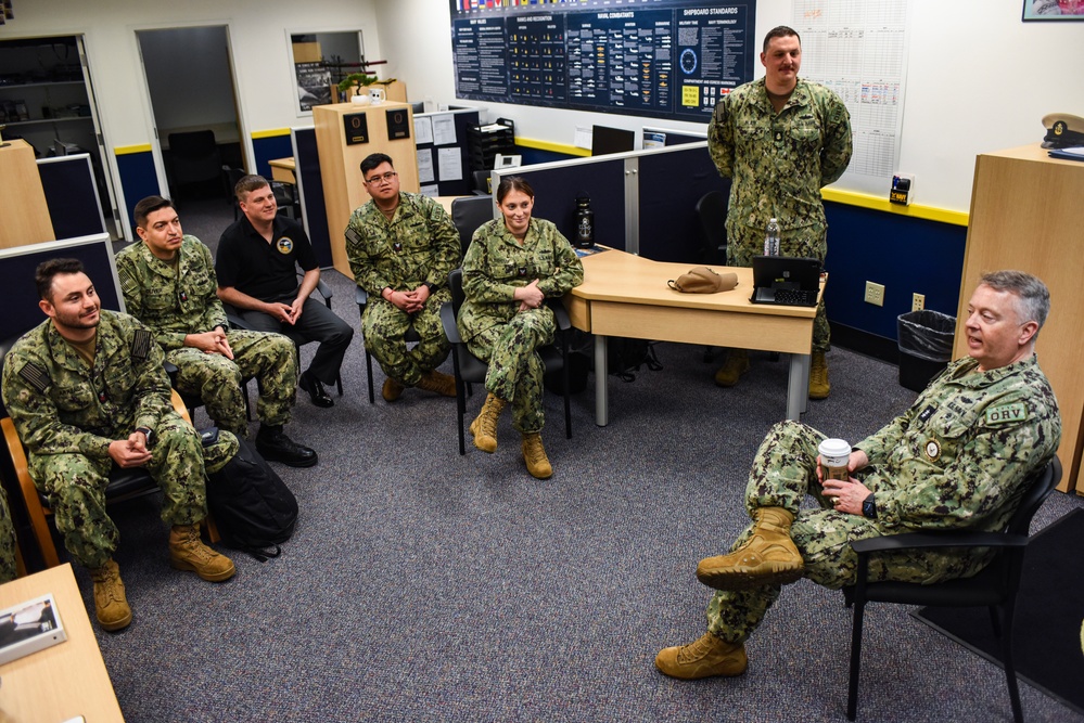 Rear Adm. James Waters, Commander, Navy Recruiting Command, right, engaged with recruiters assigned to Navy Talent Acquisition Group Ohio River Valley