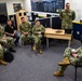 Rear Adm. James Waters, Commander, Navy Recruiting Command, right, engaged with recruiters assigned to Navy Talent Acquisition Group Ohio River Valley