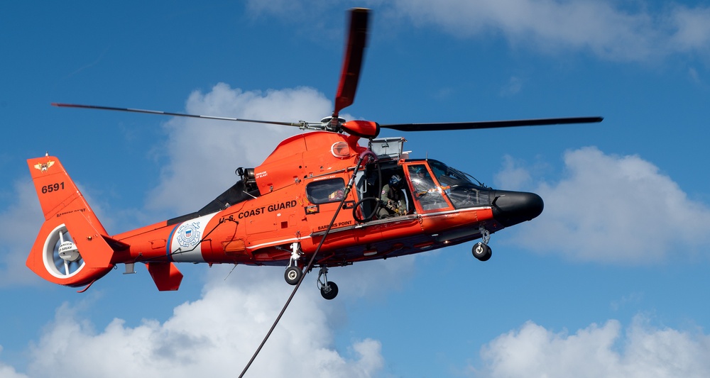 U.S. Coast Guard Cutter Stratton crew train with an U.S. Coast Guard Air Station Barbers Point MH-65 Dolphin aircrew near Hawaii