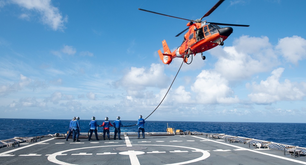 U.S. Coast Guard Cutter Stratton crew train with an U.S. Coast Guard Air Station Barbers Point MH-65 Dolphin aircrew near Hawaii