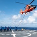 U.S. Coast Guard Cutter Stratton crew train with an U.S. Coast Guard Air Station Barbers Point MH-65 Dolphin aircrew near Hawaii