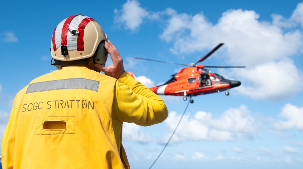 U.S. Coast Guard Cutter Stratton crew train with an U.S. Coast Guard Air Station Barbers Point MH-65 Dolphin aircrew near Hawaii