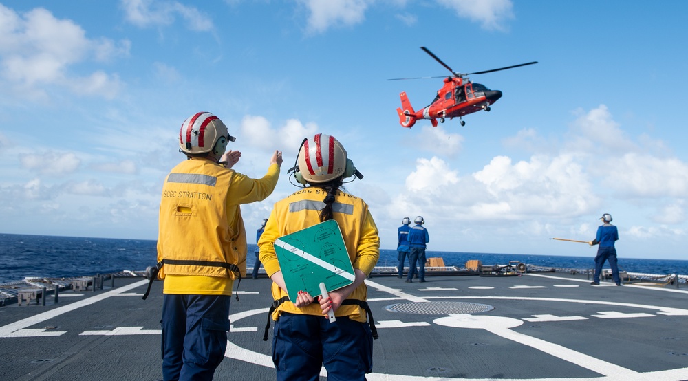 U.S. Coast Guard Cutter Stratton crew train with an U.S. Coast Guard Air Station Barbers Point MH-65 Dolphin aircrew near Hawaii