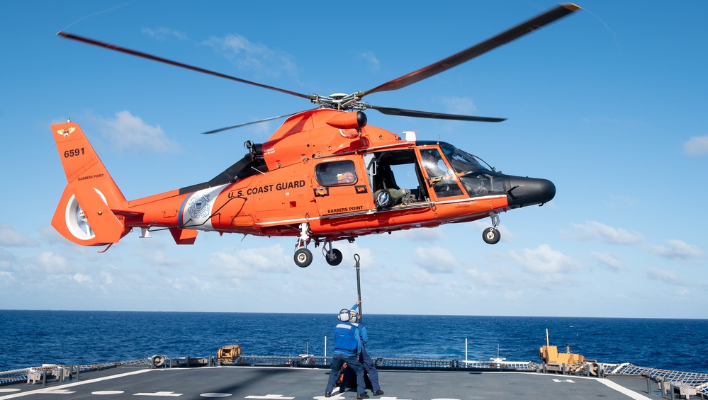 U.S. Coast Guard Cutter Stratton crew train with an U.S. Coast Guard Air Station Barbers Point MH-65 Dolphin aircrew near Hawaii