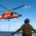 U.S. Coast Guard Cutter Stratton crew train with an U.S. Coast Guard Air Station Barbers Point MH-65 Dolphin aircrew near Hawaii
