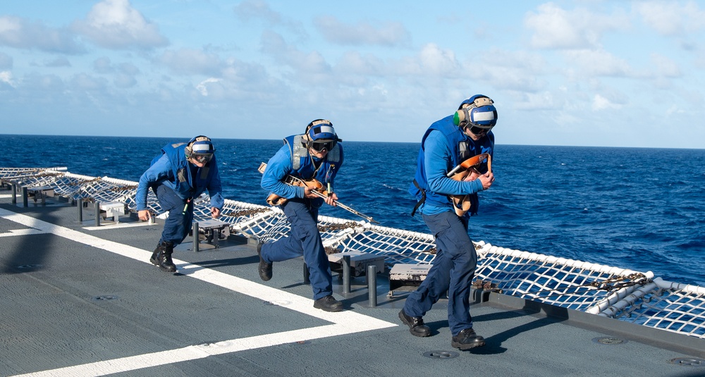 U.S. Coast Guard Cutter Stratton crew train with an U.S. Coast Guard Air Station Barbers Point MH-65 Dolphin aircrew near Hawaii