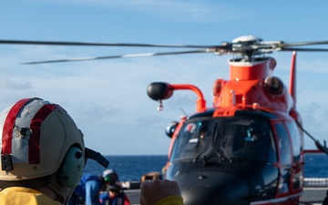 U.S. Coast Guard Cutter Stratton crew train with an U.S. Coast Guard Air Station Barbers Point MH-65 Dolphin aircrew near Hawaii