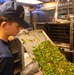 U.S. Coast Guard Cutter Stratton culinary specialists prepare lunch while transiting on the Pacific Ocean