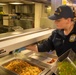 U.S. Coast Guard Cutter Stratton culinary specialists prepare lunch while transiting on the Pacific Ocean