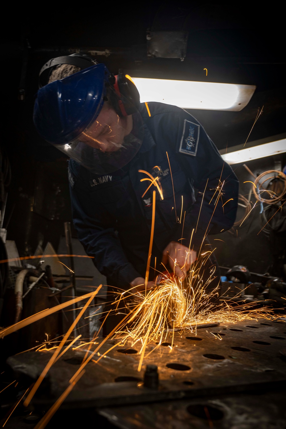 Nimitz Sailor Cuts Carbon Steel Bar Using a Cutting Disk