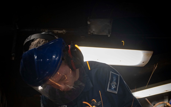 Nimitz Sailor Cuts Carbon Steel Bar Using a Cutting Disk