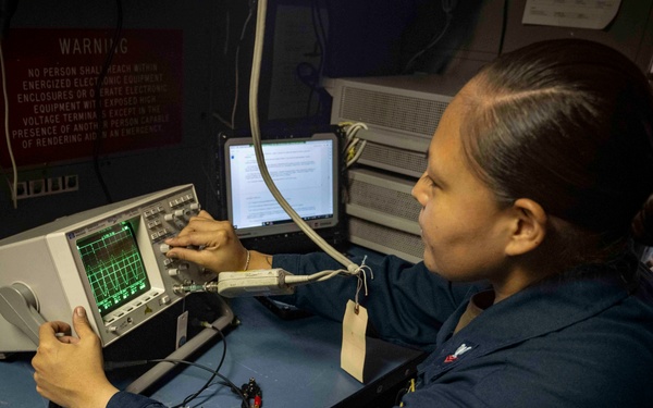 Nimitz Sailor Calibrates an Oscilloscope