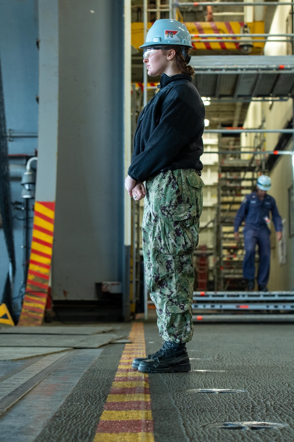 USS Ronald Reagan (CVN 76) Sailors and Puget Sound Naval Shipyard contractors conduct routine operations and ship maintenance