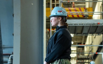 USS Ronald Reagan (CVN 76) Sailors and Puget Sound Naval Shipyard contractors conduct routine operations and ship maintenance