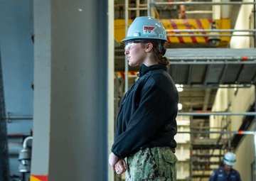 USS Ronald Reagan (CVN 76) Sailors and Puget Sound Naval Shipyard contractors conduct routine operations and ship maintenance