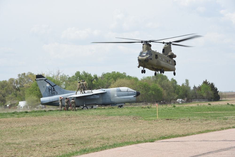 CH-47 Chinook transfers A-7 corsair static display off Martin Field