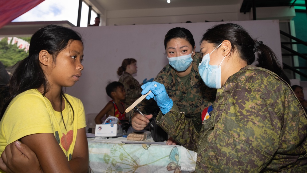 U.S., Philippines forces, provide aid to Barangay Dugui San Isidro, Virac, locals.