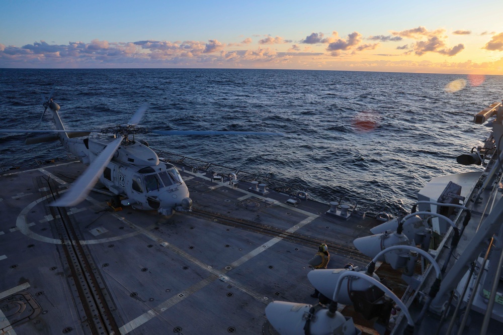 Boatswain Mate 2nd Class Jalynn Simons clears the launch of a MH-60R Sea Hawk helicopter Formidable Shield (FS) 2025