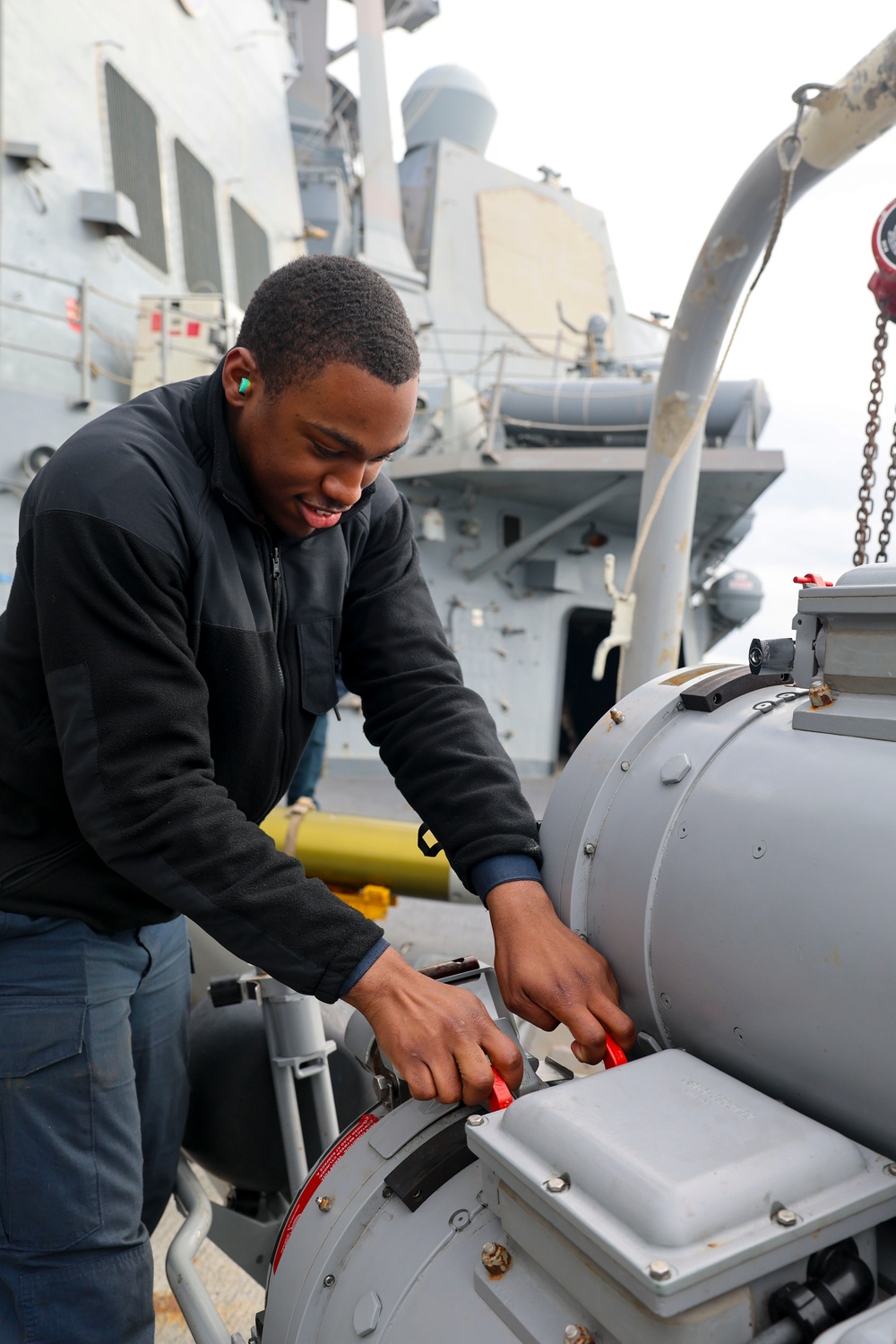 U.S. Navy Sailor conducts maintenance on a Mark 32 surface vessel torpedo tube during Formidable Shield (FS) 2025