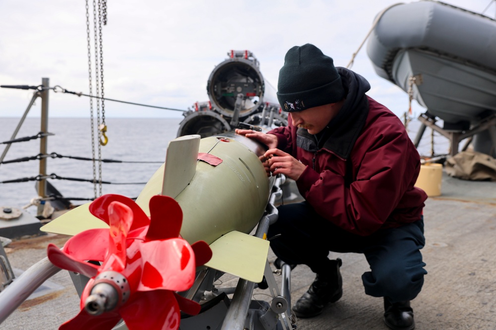U.S. Navy Sailor conducts preventative maintenance on a Mark 32 surface vessel torpedo tube during Formidable Shield (FS) 2025