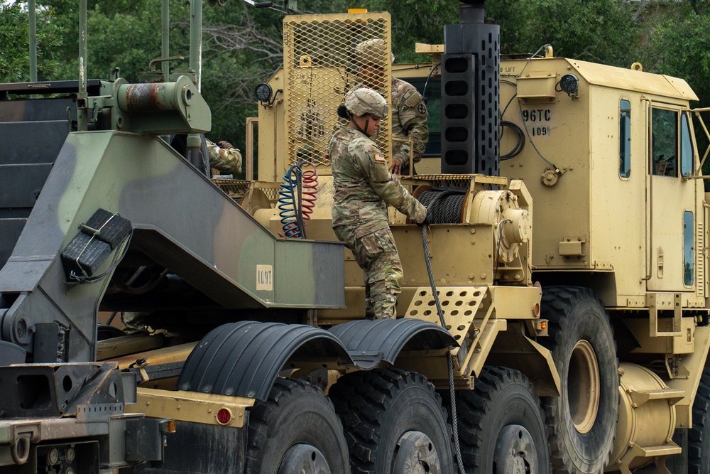 13th Armored Corps Sustainment Command Soldiers offload display truck